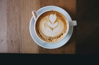 An overhead shot of latte art in a white cup on a saucer. Original public domain image from Wikimedia Commons