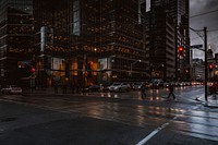 Silhouettes of pedestrians crossing a wet street in Toronto. Original public domain image from Wikimedia Commons