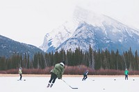 Children playing ice hockey in Banff National Park. Original public domain image from <a href="https://commons.wikimedia.org/wiki/File:Banff_National_Park,_Canada_(Unsplash_v7MGxEZlJAI).jpg" target="_blank" rel="noopener noreferrer nofollow">Wikimedia Commons</a>