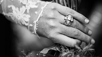 Bride wearing long lace sleeves and wedding ring in Sainte-Marie-de-Ré. Original public domain image from Wikimedia Commons