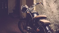 Motorbike parked by a wall. Original public domain image from Wikimedia Commons