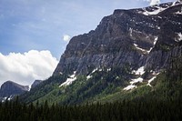 The rocky snow-covered slopes and forest valley at the Banff National Park. Original public domain image from Wikimedia Commons