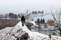 A person walking on a narrow path at Scarborough Bluffs. Original public domain image from Wikimedia Commons