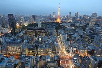 Aerial drone shot at dusk of Shiba-koen district, Minato, Tokyo, with the Tokyo Tower lit up. Original public domain image from Wikimedia Commons