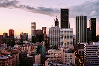 Sunset with streak of clouds covers the downtown Los Angeles sky, above One Wilshire Building and City National Bank. Original public domain image from Wikimedia Commons