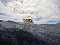 Boat in the sea. Original public domain image from Wikimedia Commons