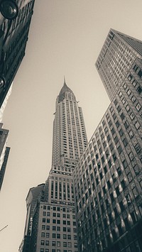 Sepia-toned skyscraper in the financial district. Original public domain image from <a href="https://commons.wikimedia.org/wiki/File:Sepia_skyscraper_(Unsplash).jpg" target="_blank" rel="noopener noreferrer nofollow">Wikimedia Commons</a>