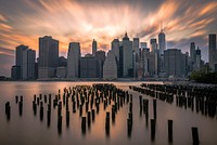 New York City from the Hudson River with the skyline and Freedom Tower in the background during sunset. Original public domain image from <a href="https://commons.wikimedia.org/wiki/File:Best_City_in_the_World_(Unsplash).jpg" target="_blank" rel="noopener noreferrer nofollow">Wikimedia Commons</a>