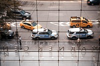 A view of vehicles out on the road from insde a building's window.. Original public domain image from <a href="https://commons.wikimedia.org/wiki/File:Fuzz_Taxi_(Unsplash).jpg" target="_blank" rel="noopener noreferrer nofollow">Wikimedia Commons</a>