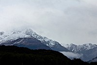 Snow-capped mountains fade into a foggy sky. Original public domain image from <a href="https://commons.wikimedia.org/wiki/File:Mountains_in_fog_(Unsplash).jpg" target="_blank" rel="noopener noreferrer nofollow">Wikimedia Commons</a>
