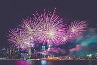 Pink fireworks in the city at night. Original public domain image from <a href="https://commons.wikimedia.org/wiki/File:Singapore_(Unsplash_yRoN-LMMGyk).jpg" target="_blank">Wikimedia Commons</a>