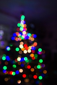 The out-of-focus, festive lights on a Christmas tree create a visual blur of dark and light. Original public domain image from Wikimedia Commons