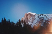 The Half Dome summit in Yosemite Valley under starry evening sky. Original public domain image from Wikimedia Commons