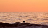Man staning in ocean sunset. Original public domain image from <a href="https://commons.wikimedia.org/wiki/File:Oceanside,_United_States_(Unsplash).jpg" target="_blank">Wikimedia Commons</a>
