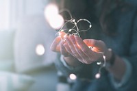 Woman holding fairy lights. Original public domain image from Wikimedia Commons