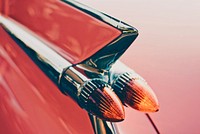 Close-up of a glossy part of a red car body. Original public domain image from Wikimedia Commons