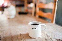 A white coffee mug with “begin” written on it on a wooden table. Original public domain image from <a href="https://commons.wikimedia.org/wiki/File:Begin._(Unsplash).jpg" target="_blank" rel="noopener noreferrer nofollow">Wikimedia Commons</a>