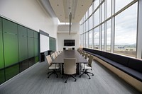 An empty elegant boardroom with a long table and tall windows. Original public domain image from <a href="https://commons.wikimedia.org/wiki/File:Elegant_boardroom_(Unsplash).jpg" target="_blank" rel="noopener noreferrer nofollow">Wikimedia Commons</a>