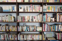 A bookshelf with lots of colored books. Original public domain image from Wikimedia Commons