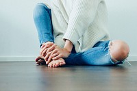 Woman sitting on a floor. Original public domain image from Wikimedia Commons