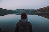 A woman staring off into the distance in Pontsticill Reservoir, United Kingdom. Original public domain image from Wikimedia Commons