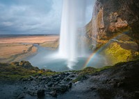 Rainbow and a waterfall in Seljalandsfoss, Iceland. Original public domain image from <a href="https://commons.wikimedia.org/wiki/File:Seljalandsfoss,_Iceland_(Unsplash).jpg" target="_blank">Wikimedia Commons</a>