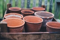 Empty terracotta pots in a wooden crate. Original public domain image from <a href="https://commons.wikimedia.org/wiki/File:Terracota_(Unsplash).jpg" target="_blank" rel="noopener noreferrer nofollow">Wikimedia Commons</a>