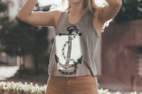 A woman in a tank top raises her arms outdoors in the sun. Original public domain image from <a href="https://commons.wikimedia.org/wiki/File:Anchor_Girl_(Unsplash).jpg" target="_blank" rel="noopener noreferrer nofollow">Wikimedia Commons</a>