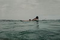 Woman surfing in Knysna, South Africa. Original public domain image from Wikimedia Commons