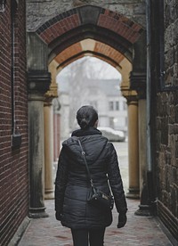 Woman walking through the arched alley. Original public domain image from <a href="https://commons.wikimedia.org/wiki/File:Moving_Forward_(Unsplash).jpg" target="_blank">Wikimedia Commons</a>