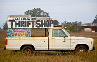 A rusty truck with a sign pointing towards a thrift shop. Original public domain image from <a href="https://commons.wikimedia.org/wiki/File:Vintage_truck_(Unsplash).jpg" target="_blank" rel="noopener noreferrer nofollow">Wikimedia Commons</a>