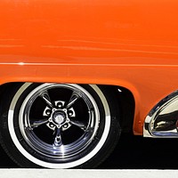 A classic tire on an orange sports car in Havana. Original public domain image from Wikimedia Commons