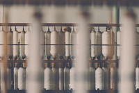 Spools of white cotton threads on a machine in a factory in Rydal. Original public domain image from Wikimedia Commons