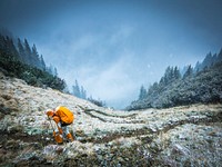 Person walking on mountain during daytime. Original public domain image from Wikimedia Commons