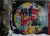 Make art not war colorful graffiti message on urban wall in Istanbul. Original public domain image from Wikimedia Commons