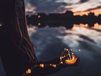 Woman holding string lights in Ivanovo, Russia. Original public domain image from Wikimedia Commons