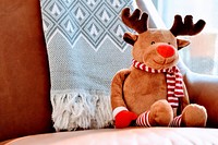 Cute Rudolf reindeer doll on armchair. Original public domain image from Wikimedia Commons