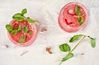 Jars filled with strawberry liquor and mint leaves. Original public domain image from <a href="https://commons.wikimedia.org/wiki/File:Strawberry_Mojito_(Unsplash).jpg" target="_blank">Wikimedia Commons</a>