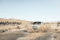 off-roader truck drives through dusty rural roads in the Mount Charleston desert. Original public domain image from Wikimedia Commons