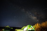 Camping under the starry night sky. Original public domain image from <a href="https://commons.wikimedia.org/wiki/File:Goblin_Valley_Road,_Green_River,_United_States_(Unsplash_Rr2yGOzR5t8).jpg" target="_blank">Wikimedia Commons</a>