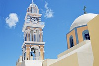 Blue and white of classic Greek buildings on the seashore. Original public domain image from Wikimedia Commons