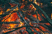 Hot embers and flames in a fire pit filled with firewood and twigs at Wydale Hall & Emmaus Centre. Original public domain image from Wikimedia Commons