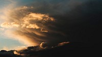 A dramatic cloudy sky during golden hour. Original public domain image from Wikimedia Commons