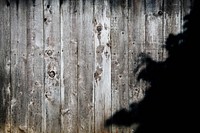 A black shade on a wooden plank wall. Original public domain image from <a href="https://commons.wikimedia.org/wiki/File:Fenced_In_(Unsplash).jpg" target="_blank" rel="noopener noreferrer nofollow">Wikimedia Commons</a>
