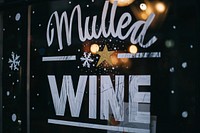 An artwork reading “mulled wine” on a glass window of a store in Soho. Original public domain image from Wikimedia Commons