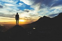 Silhouette of man on a mountain. Original public domain image from Wikimedia Commons