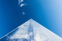 A low-angle shot of an imposing skyscraper against a blue sky. Original public domain image from Wikimedia Commons