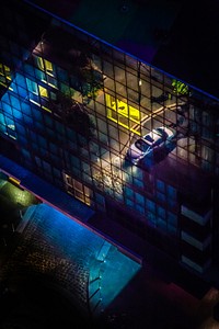 Reflection of car illuminated on building exterior in Docklands. Original public domain image from Wikimedia Commons
