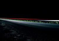 Time lapse red car light at night on road with asphalt and grass, Casale Sul Sile. Original public domain image from Wikimedia Commons