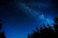 Milky way over a dark forest. Original public domain image from <a href="https://commons.wikimedia.org/wiki/File:M_wrona_2017-05-30_(Unsplash).jpg" target="_blank">Wikimedia Commons</a>